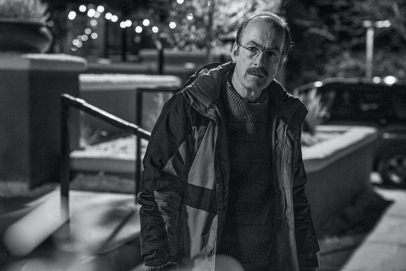 Gene Takavic (Bob Odenkirk) sits against an exterior wall in 'Better Call Saul' Season 6 Episode 11 'Breaking Bad'