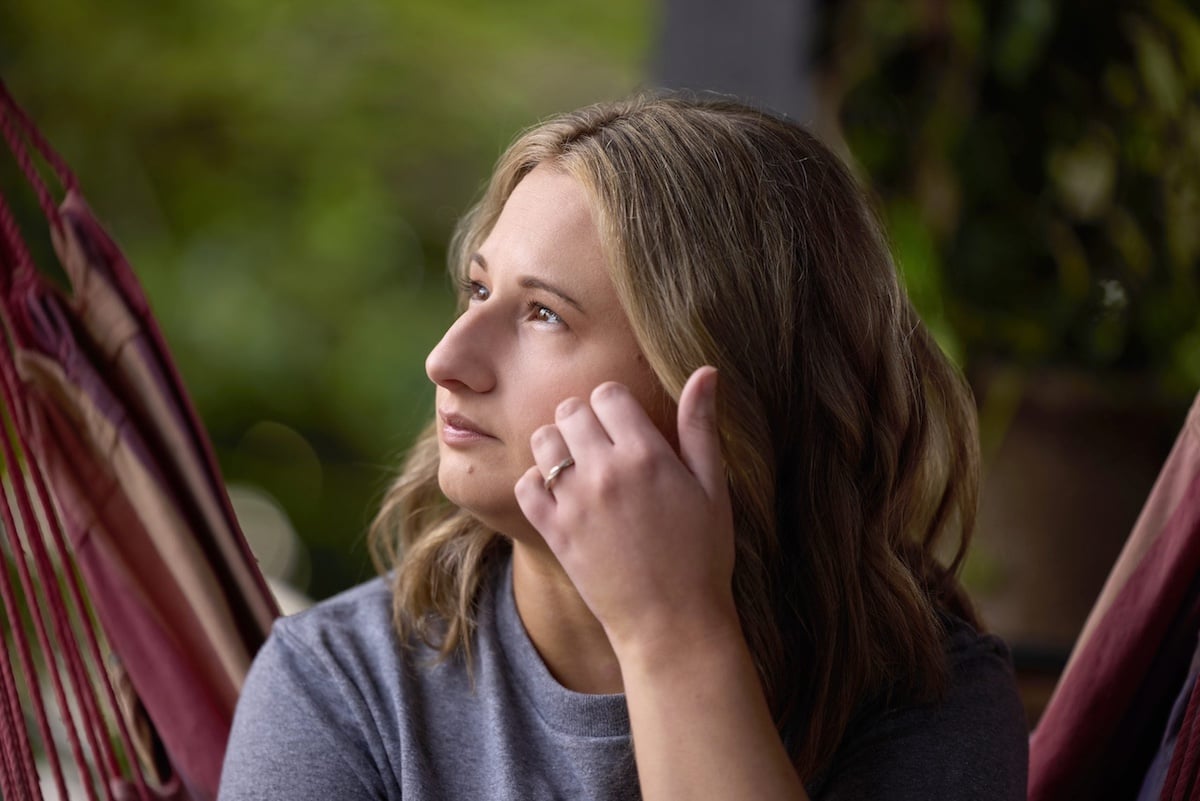 Gypsy Rose Blanchard in profile with her hand touching her cheek