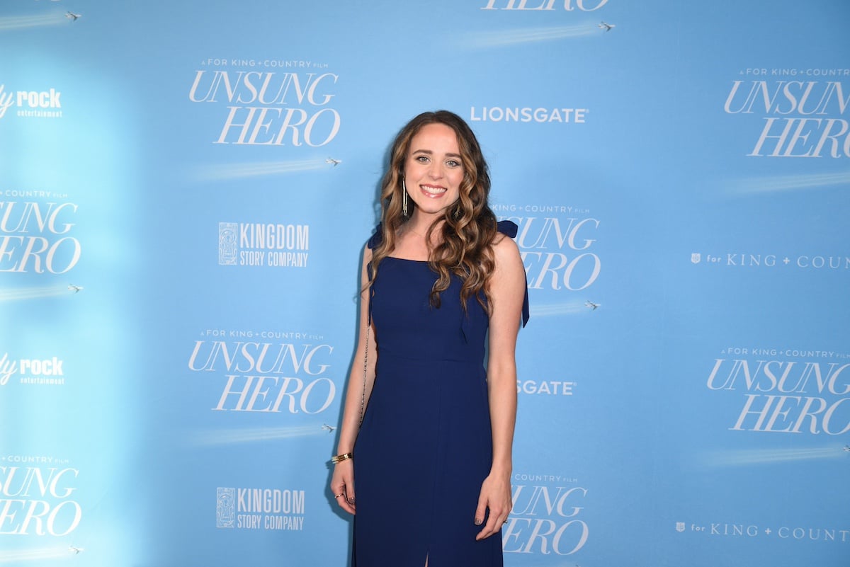 Jinger Duggar wearing a blue dress while attending the "Unsung Hero" screening at Lionsgate on April 17, 2024 in Santa Monica, California