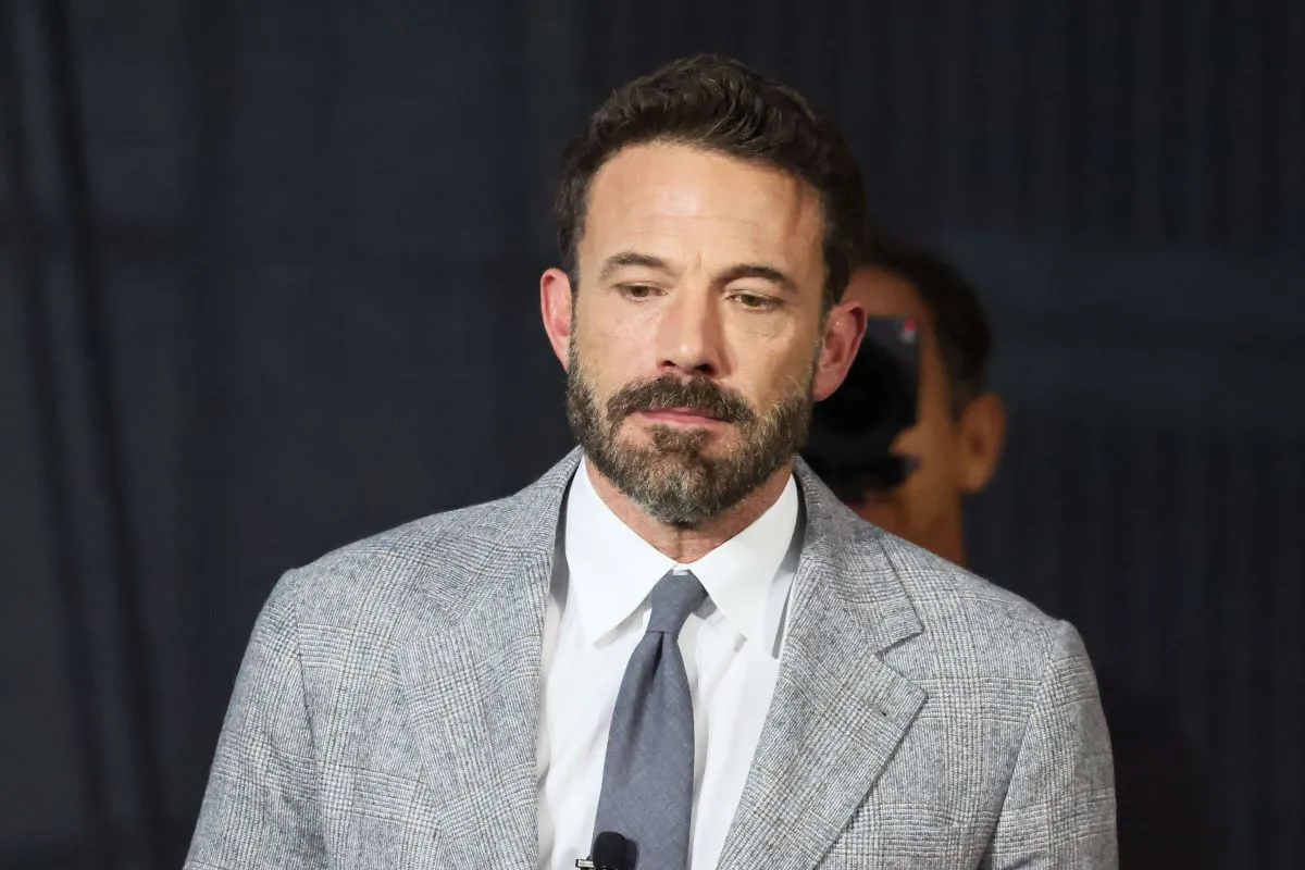 Ben Affleck wears a gray suit with a gray tie.