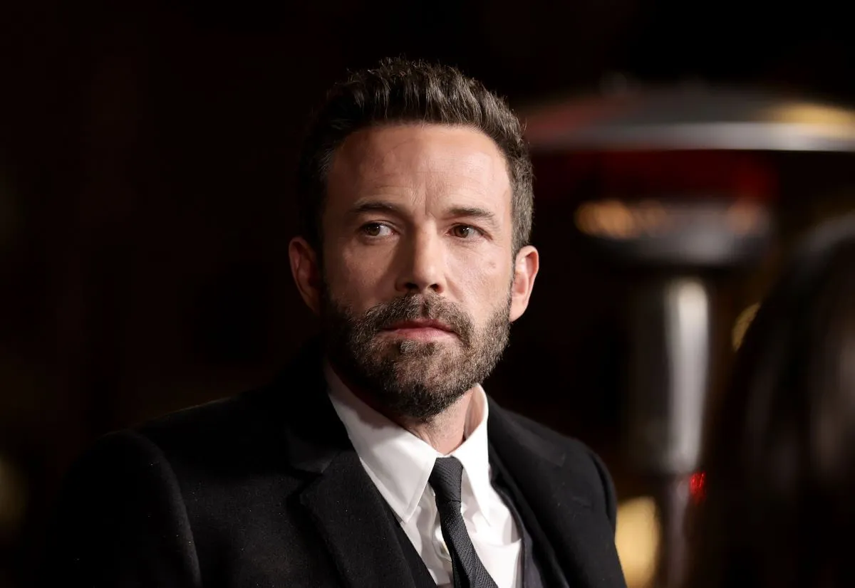 Ben Affleck wears a suit.