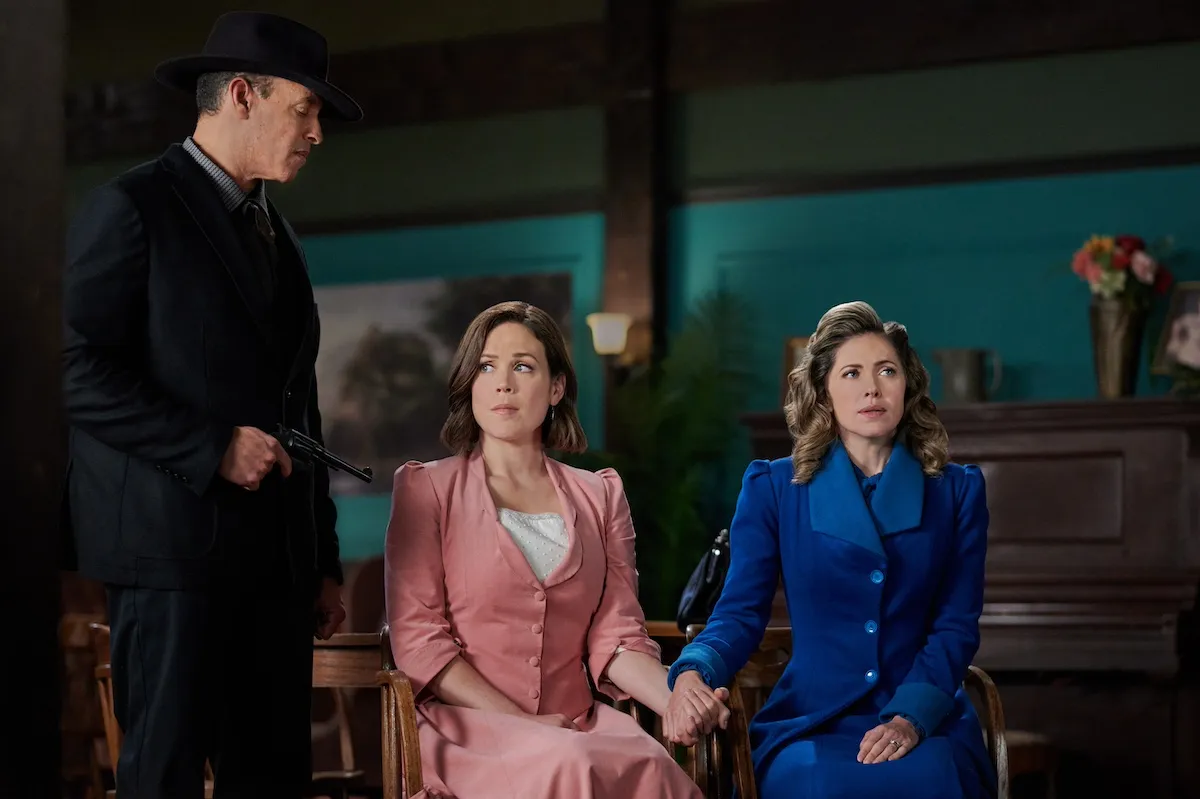 Elizabeth and Rosemary holding hands while being held hostage in an episode of 'When Calls the Heart'