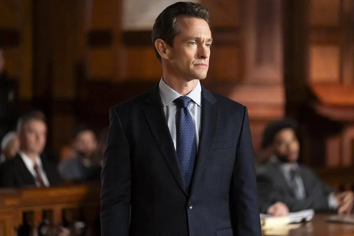 Lawyer in a suit standing in a courtroom in 'Law & Order'