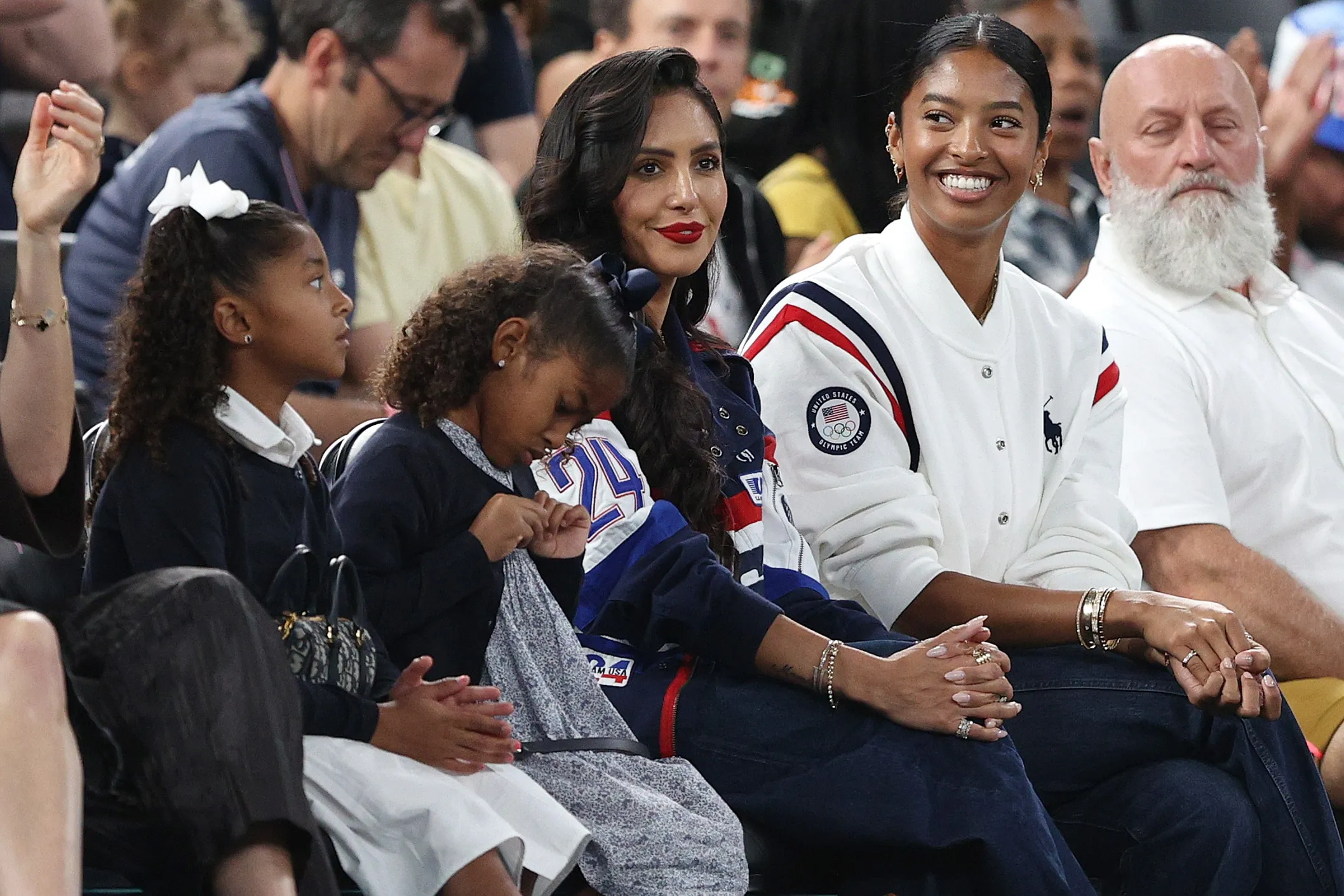 The Summer Olympics host Vanessa Bryant and daughters Capri, Bianka, and Natalia Bryant as they sit courtside during a women's basketball game